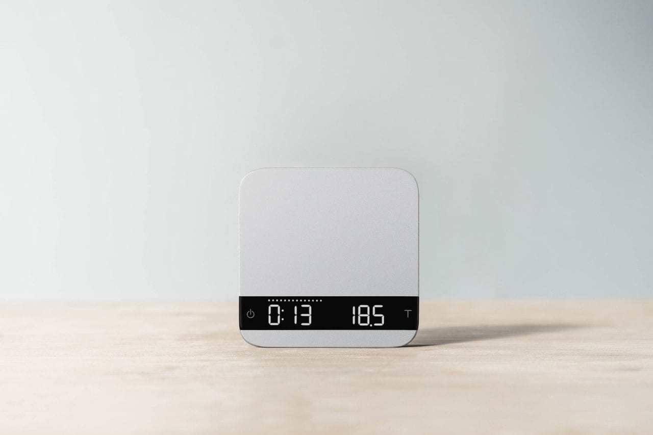 Acaia Lunar in silver on a wooden counter
