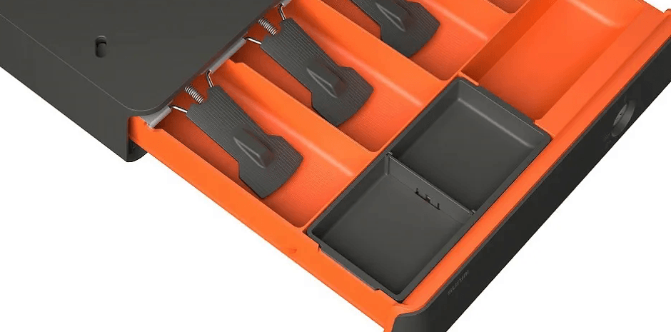 Inside the drawer: spring bill clips and removable coin trays