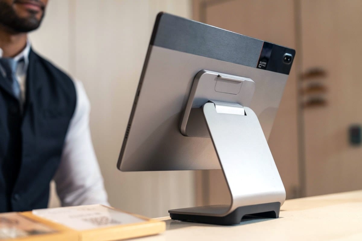 CPad on the desktop base at a reception counter